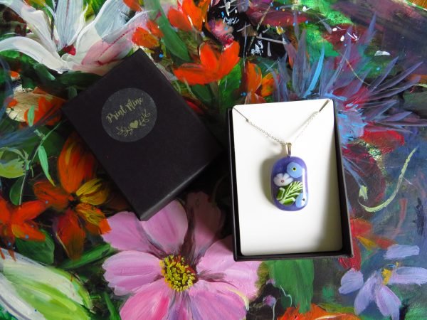 fused glass pendant with for get me not design purple glass